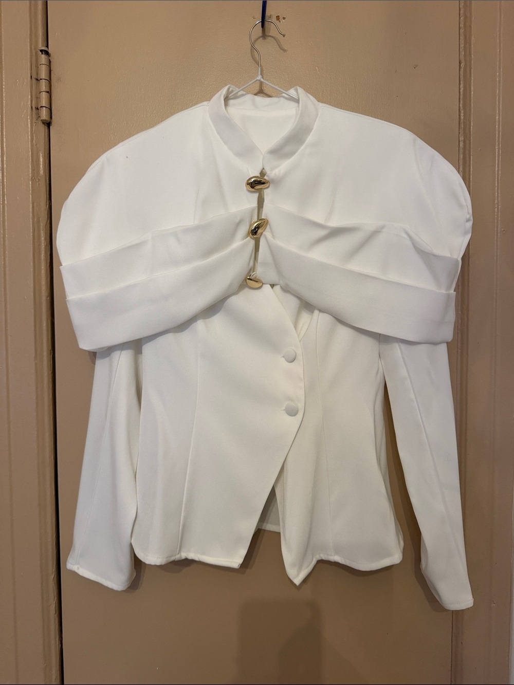 Elegant White Draped Shoulder Blouse with Gold Accent
